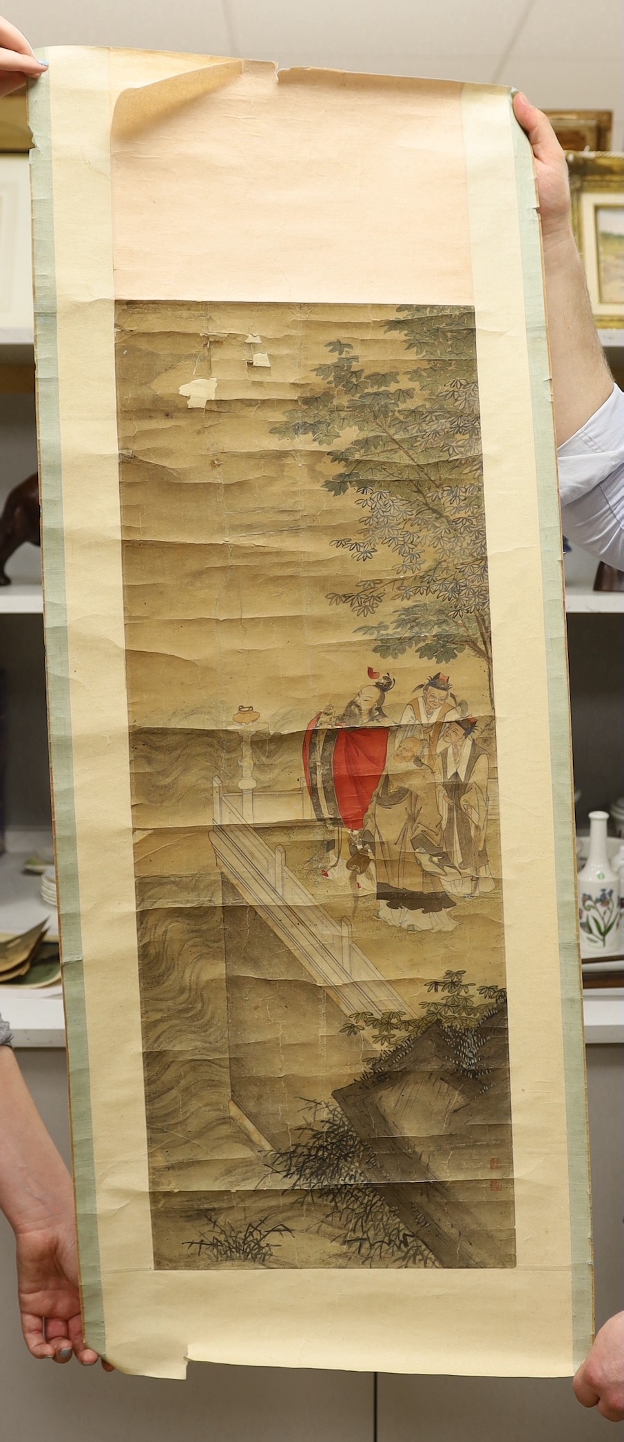 A 19th century Chinese scroll painting on paper of four scholars in a landscape